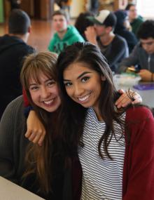 Two high school girls smiling